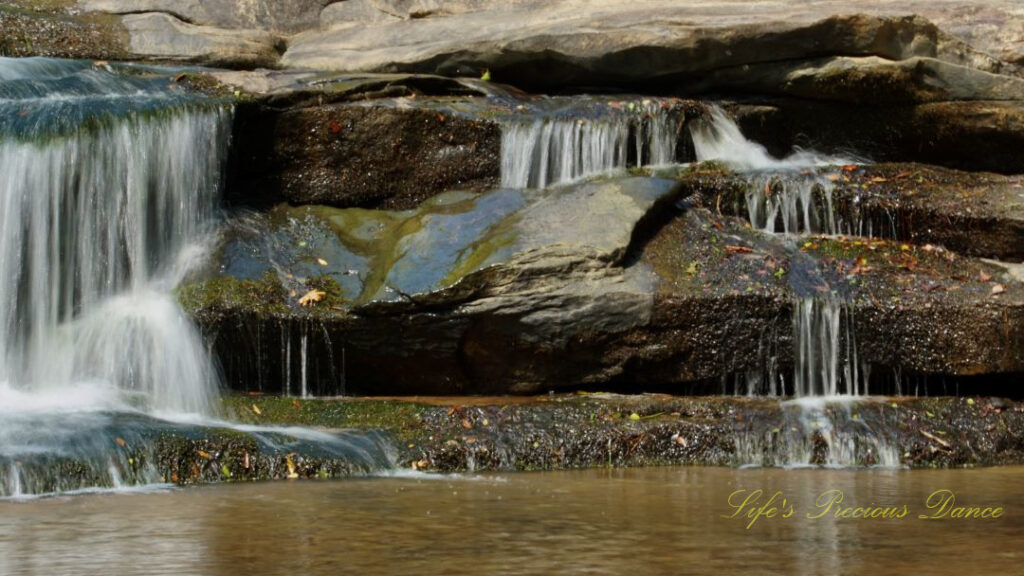 Close up of Horseshoe Falls spilling over rocks into the Enoree River.