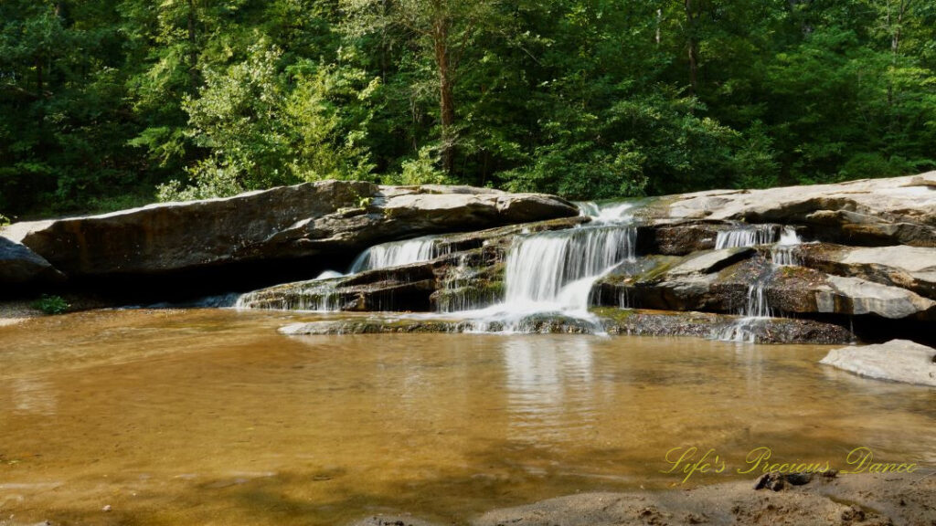 Horseshoe Falls spilling over rocks into the Enoree River.