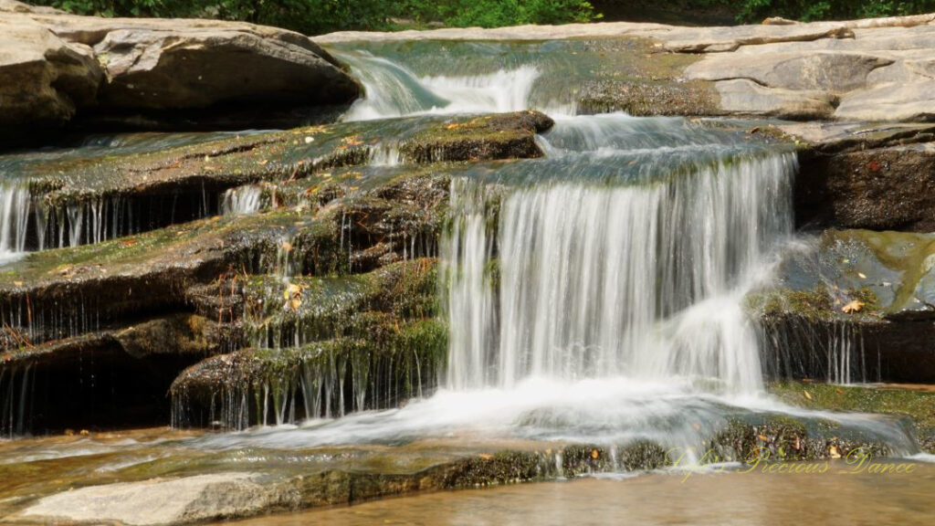 Close up of Horseshoe Falls spilling over rocks into the Enoree River.