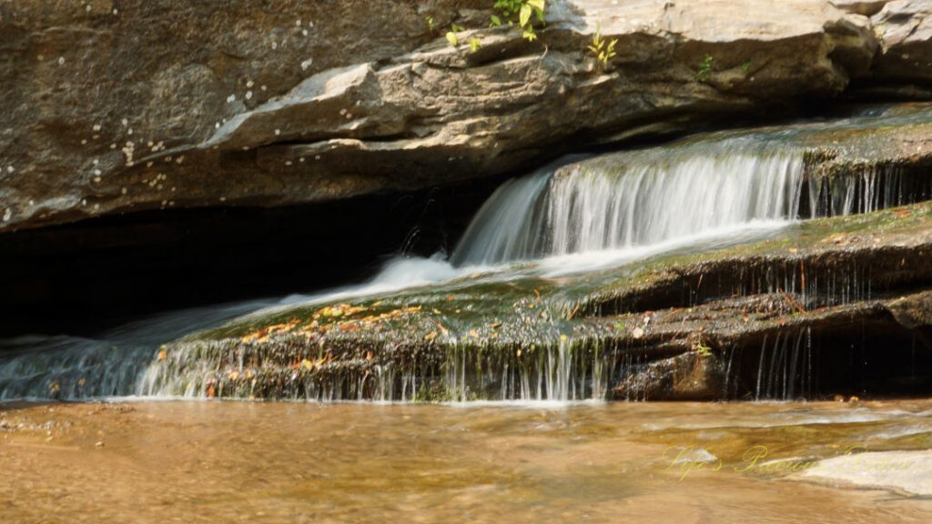 Close up of Horseshoe Falls spilling over rocks into the Enoree River.