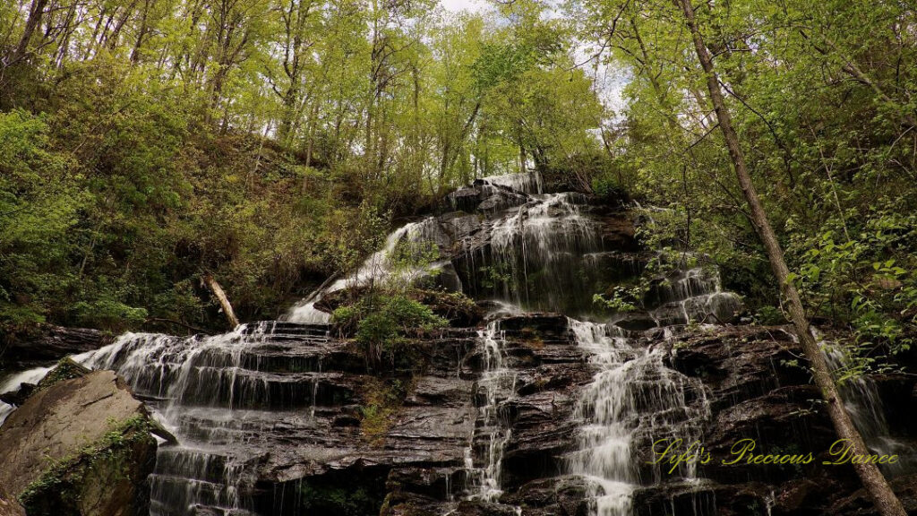 Upper section of Issaqueena Falls spilling down the jagged rockface.