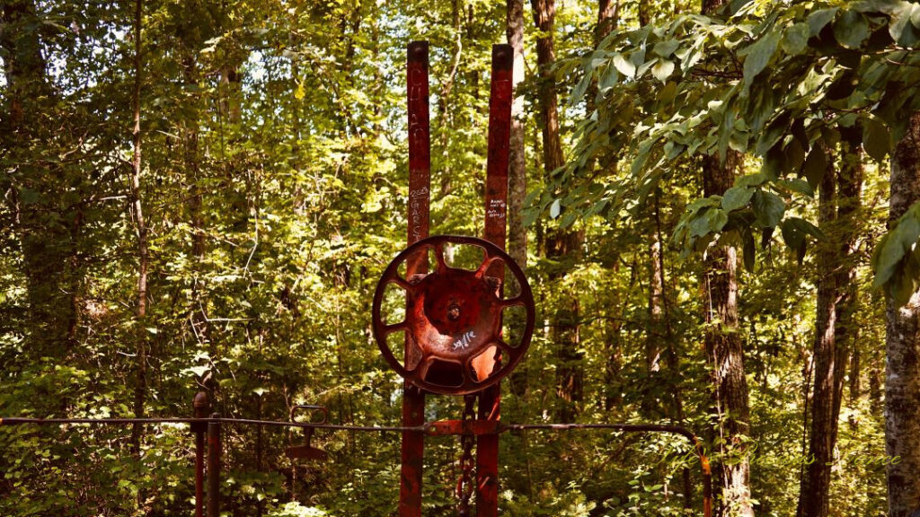 Rusted steering wheel on an old rail car at Stumphouse Park.