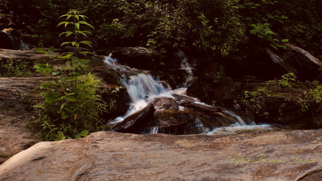 Lower section of Issaqueena Falls spilling over the rocks.