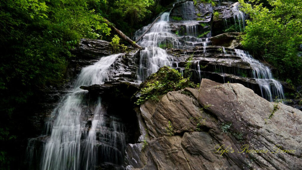 Upward look at Issaqueena Falls spilling down the rockface.