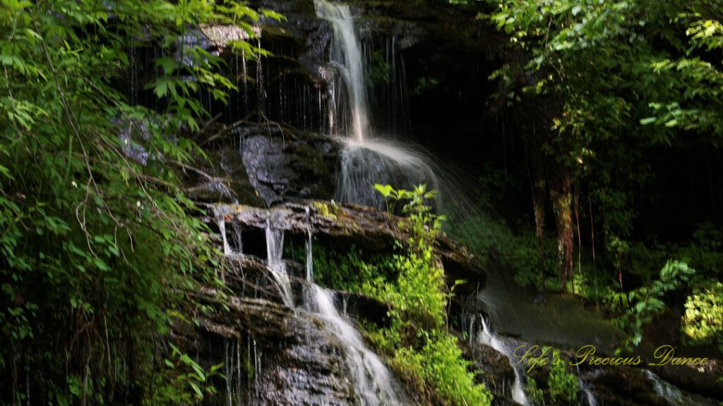 Close up of the middle section of Issaqueena Falls spilling down the jagged rockface.