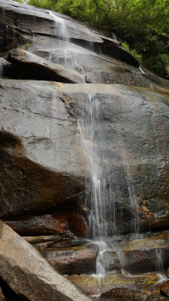 Daniel Ridge Falls cascading down and over the rockface.