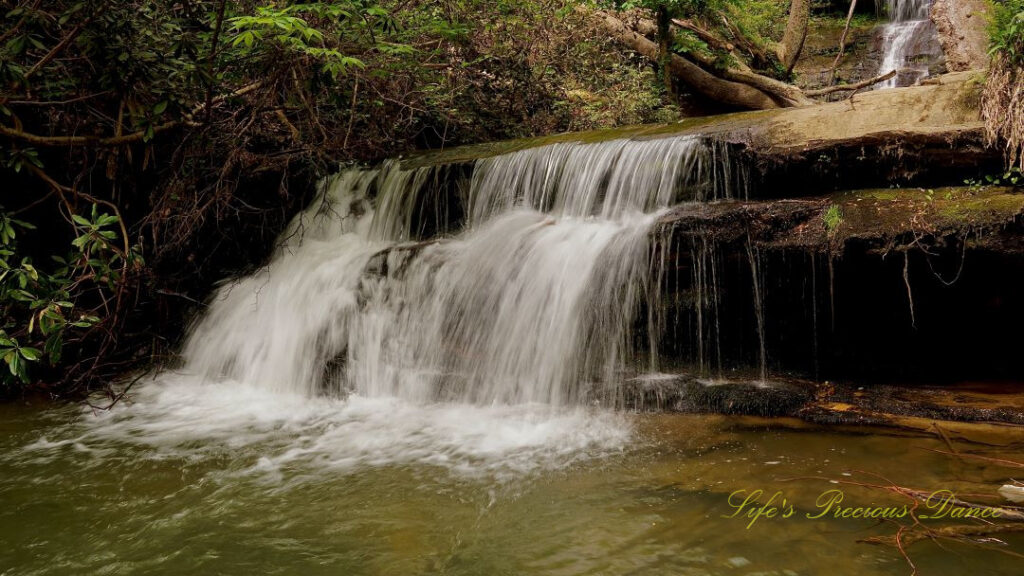 Lower section of Yellow Branch Falls spilling over a rock ledge into the creek.