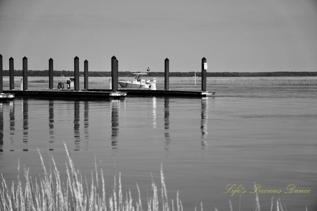 Black and white of a fishing boat coming in to dock at Big Bear Creek,