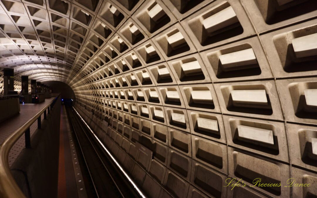 Looking down the track of the tunnel at DC Metro station.