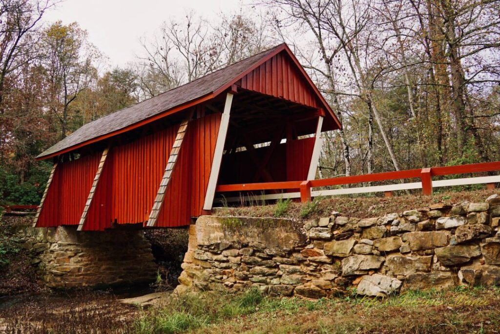 Front and side view of Campbell&#039;s Covered Bridge spanning the creek.