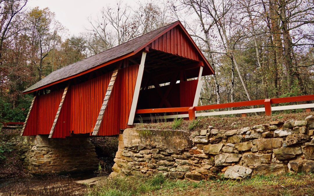 Front and side view of Campbell's Covered Bridge spanning the creek.