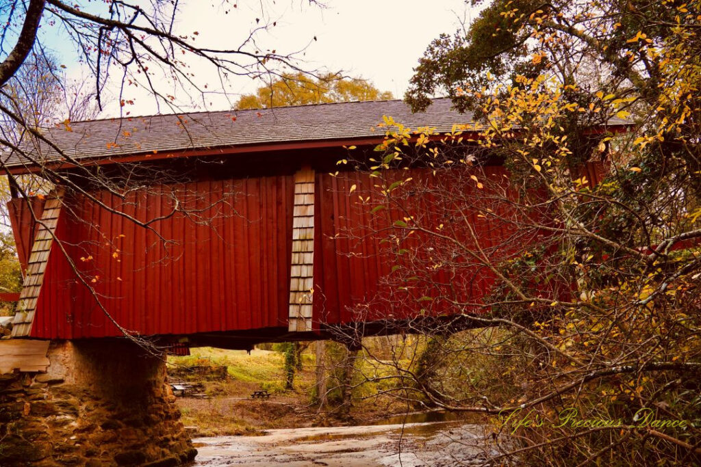 Looking upward from the creek at the side of Campbell&#039;s Covered Bridge.