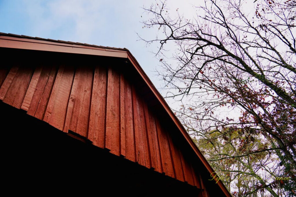 Looking upward at the roof and entrance of Campbell&#039;s Covered Bridge.